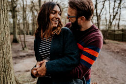 clients laughing during engagement photoshoot in London