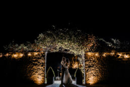 bride and groom night time photo at Priston mill